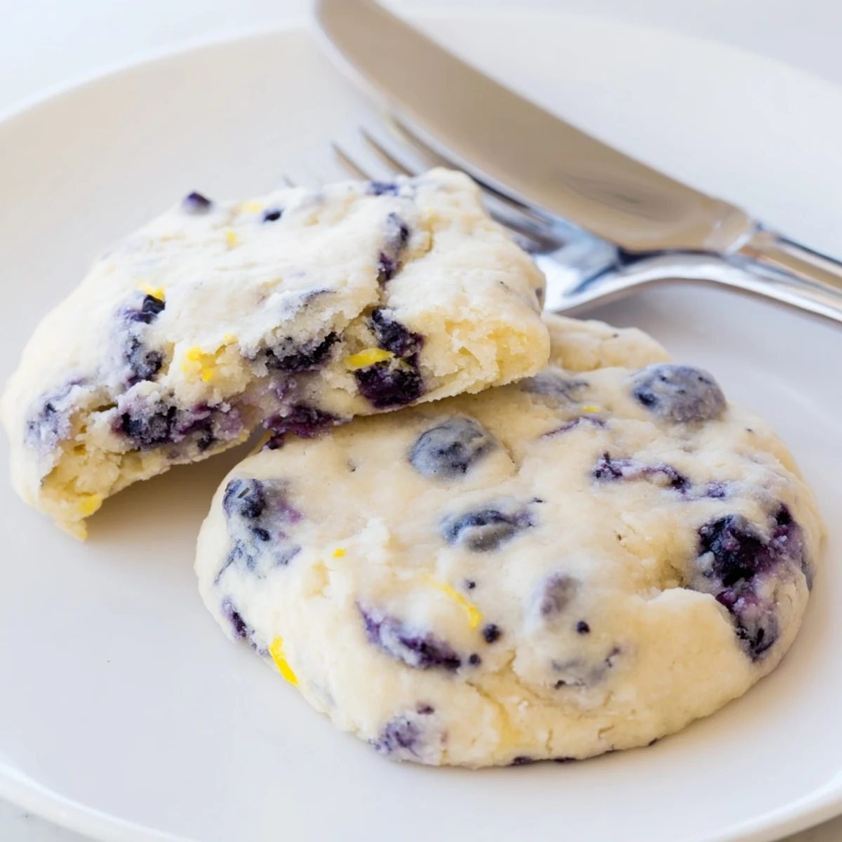 Homemade lemon blueberry cheesecake cookies featuring juicy blueberries in a soft tender cream cheese dough