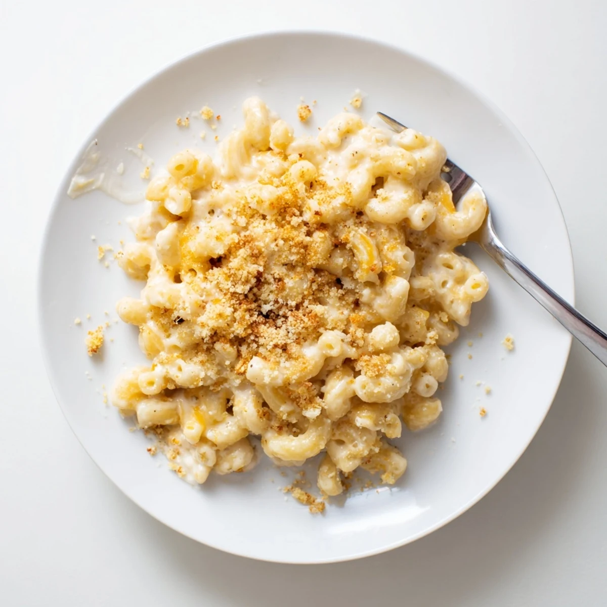 Rich melted cheddar and herbed Boursin cheese sauce coating elbow macaroni pasta strands