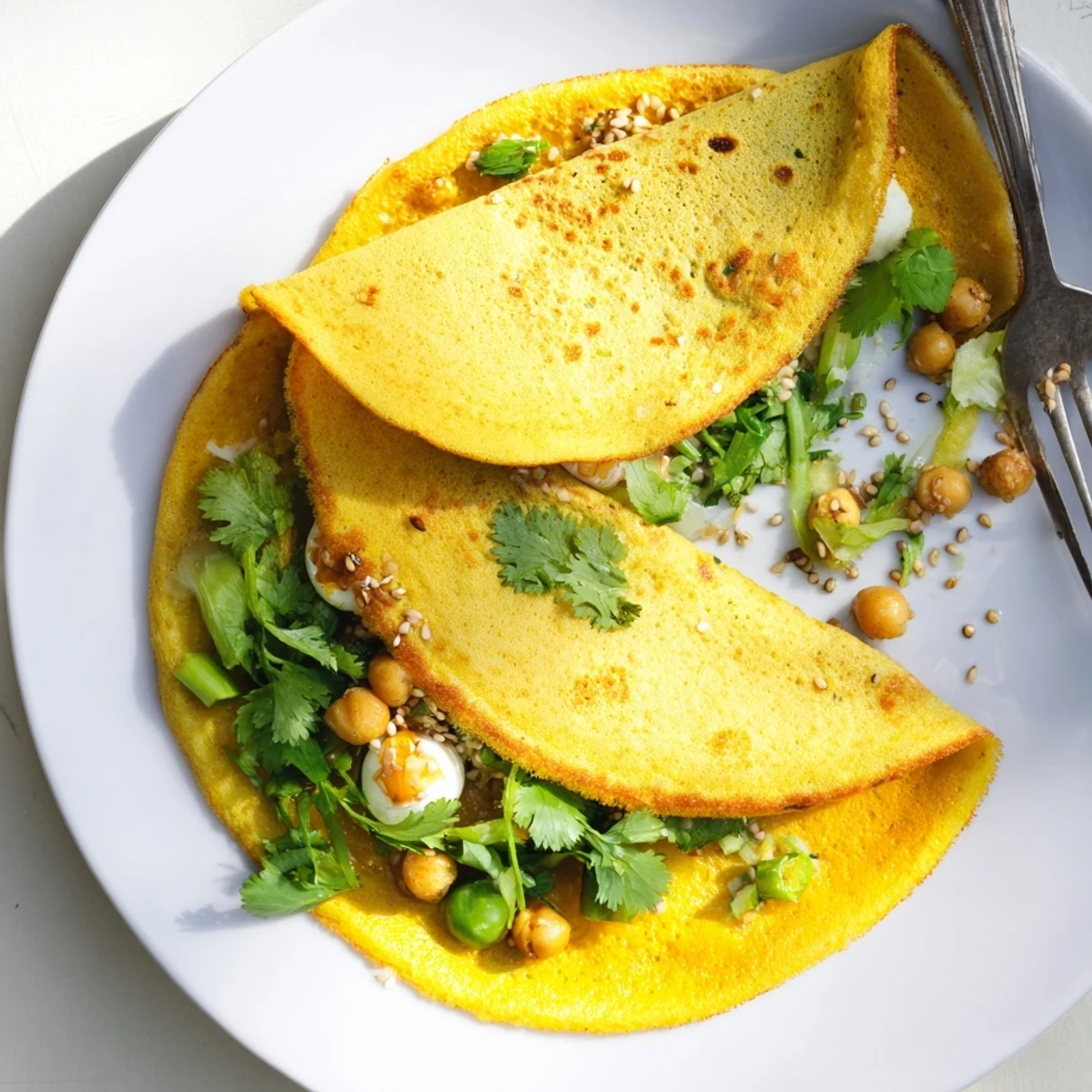 Paired Mont Lin Ma Yar pancakes served hot with coconut and cilantro garnish