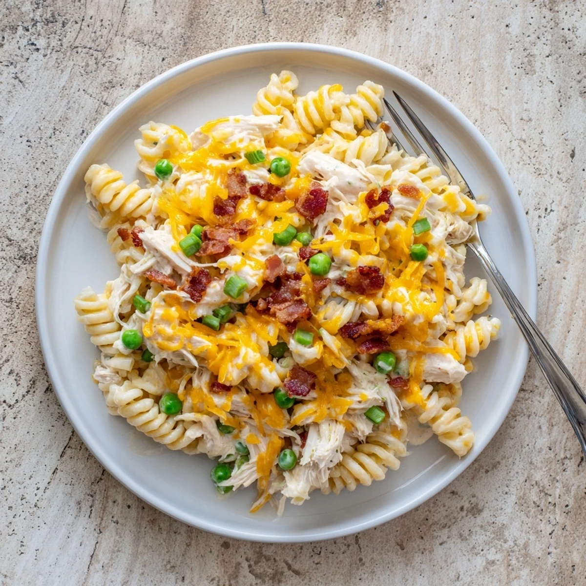 Slow cooker Crack Chicken Casserole featuring tender pasta in a rich ranch cheese sauce