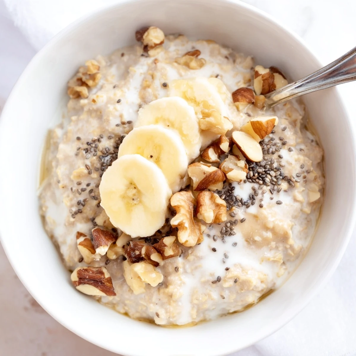 Creamy Protein Oatmeal steaming in bowl, hint of maple syrup