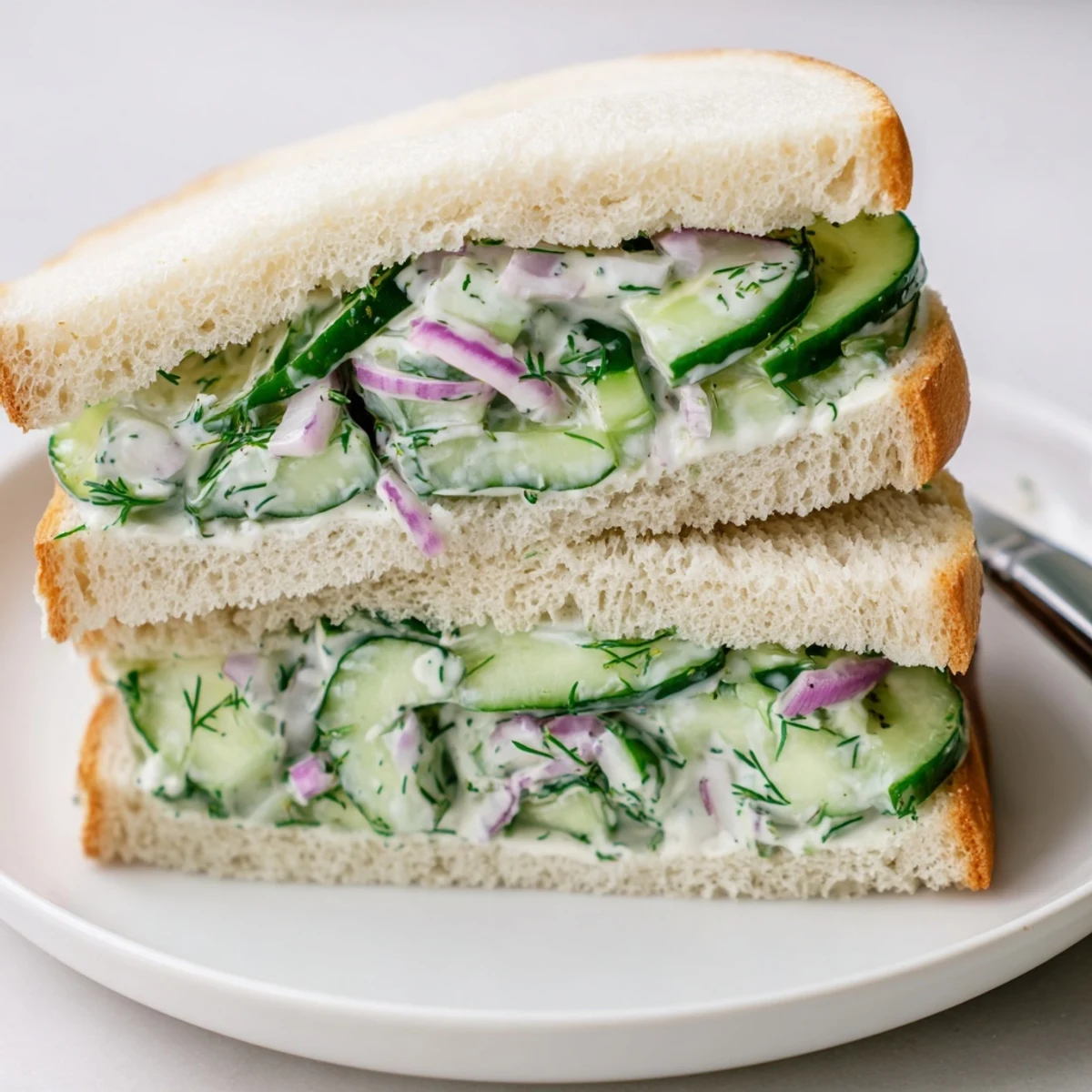 Quick Cucumber Salad Sandwiches sliced diagonally, chilled, garnished with fresh dill.