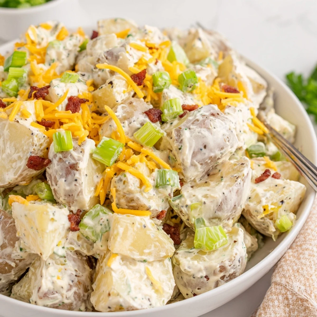 Creamy, smoky Beef Bacon Loaded Potato Salad Recipe For A Crowd Delight with cheddar