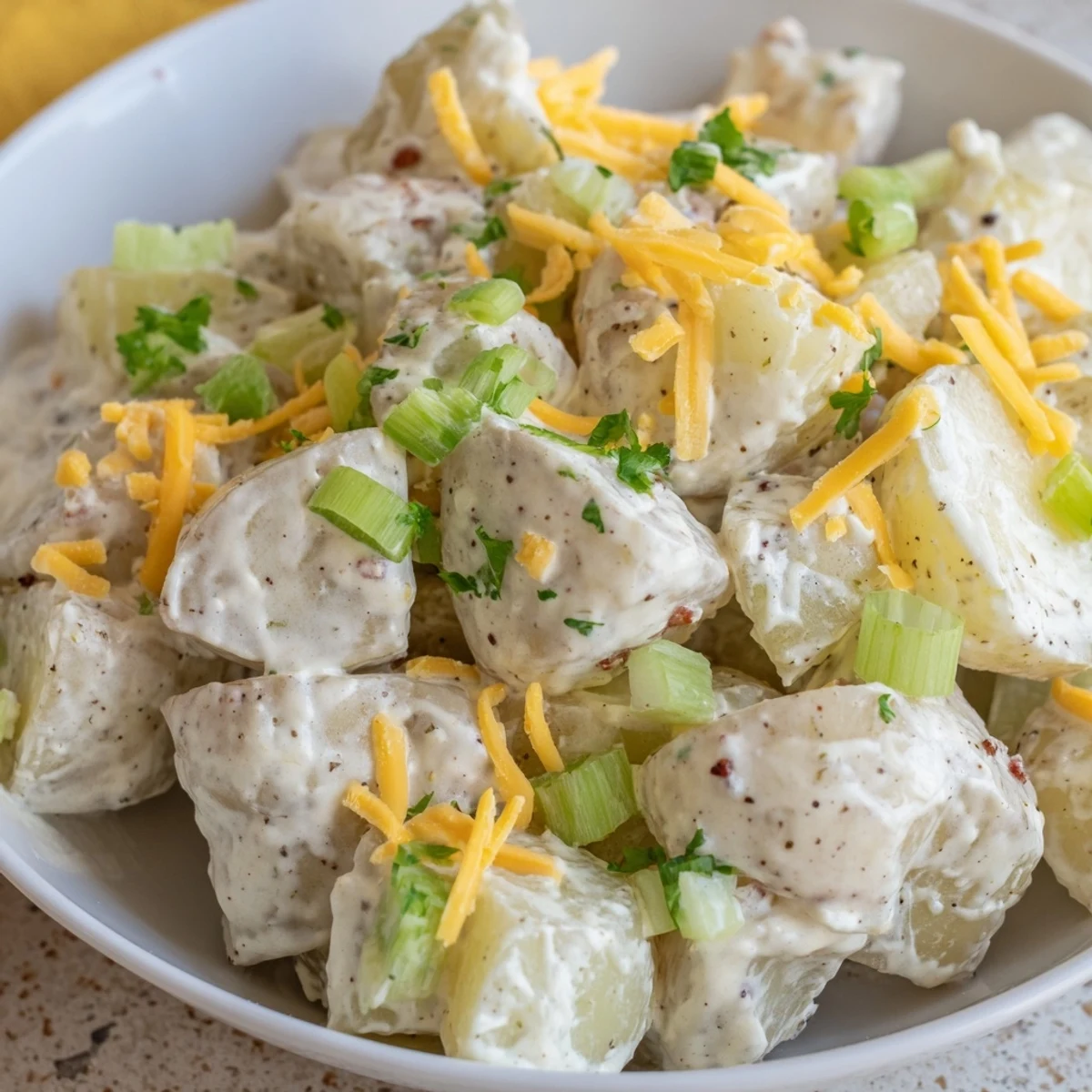 Smoky, crisp toppings on Beef Bacon Loaded Potato Salad Recipe For A Crowd Delight