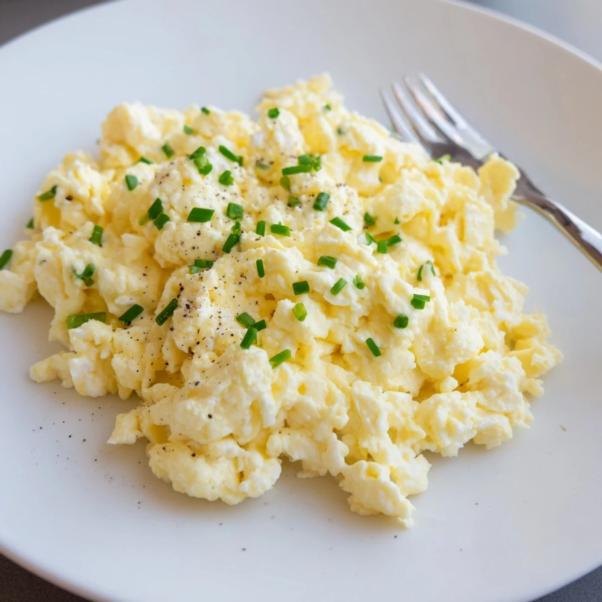 Cottage Cheese Scrambled Eggs With Chives: fluffy, creamy curds steaming on toast