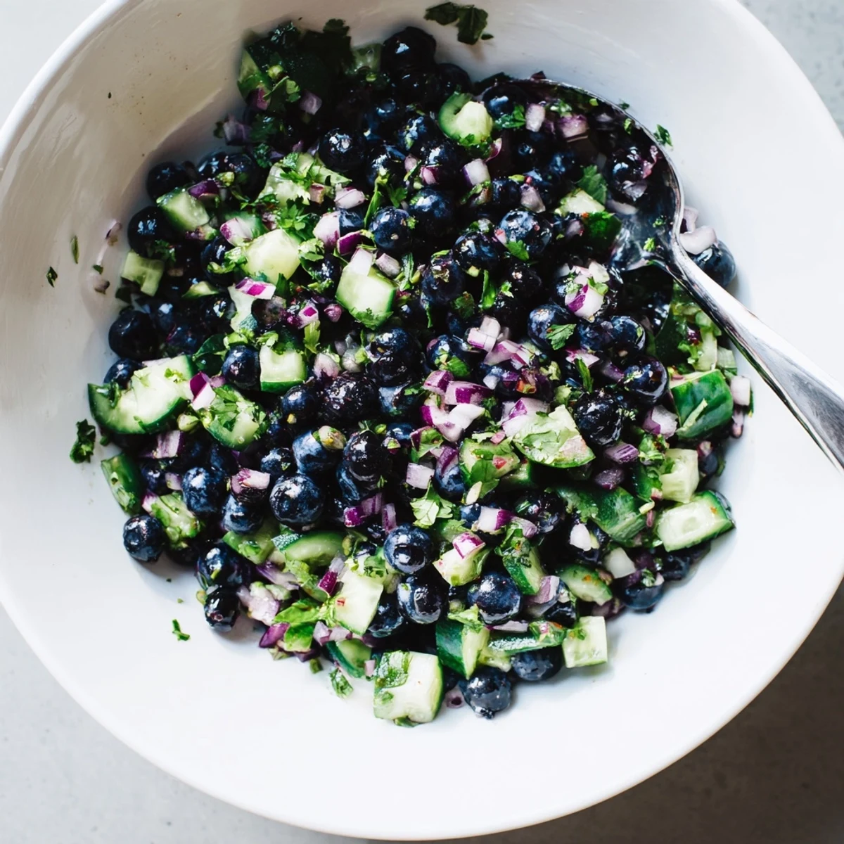Vibrant blueberry cucumber salsa topped with cilantro and lime juice